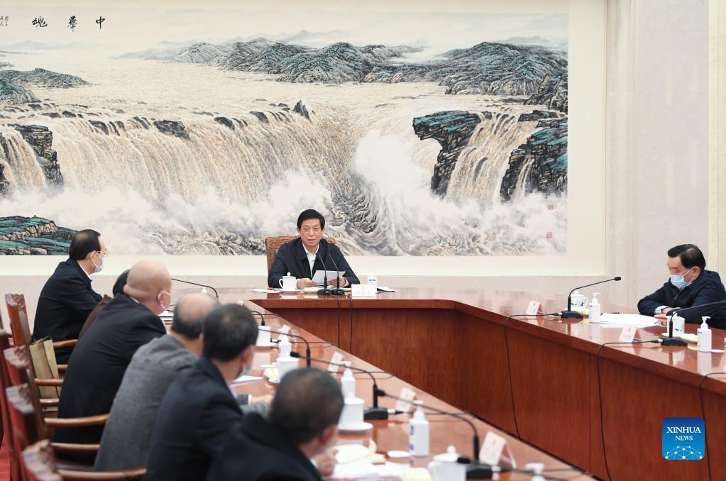 China\s top legislator attends symposium with lawmakers(图1)